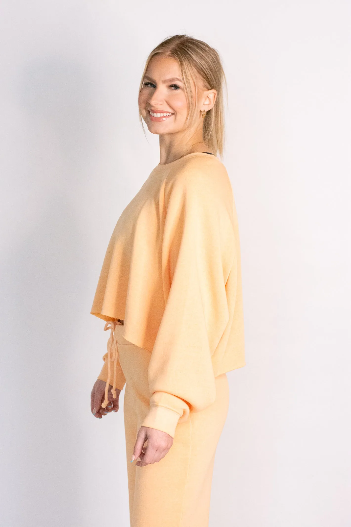 Cropped orange sweatshirt top