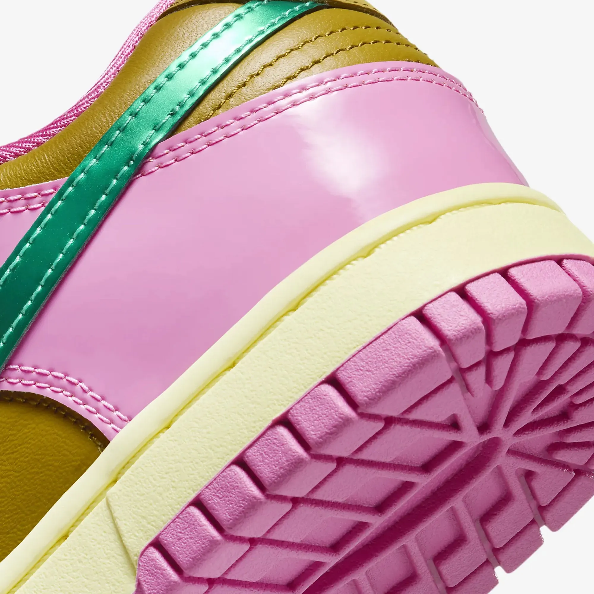 Nike women's Dunk Low X Parris Goebel sneakers in playful pink and multi-color bronzine