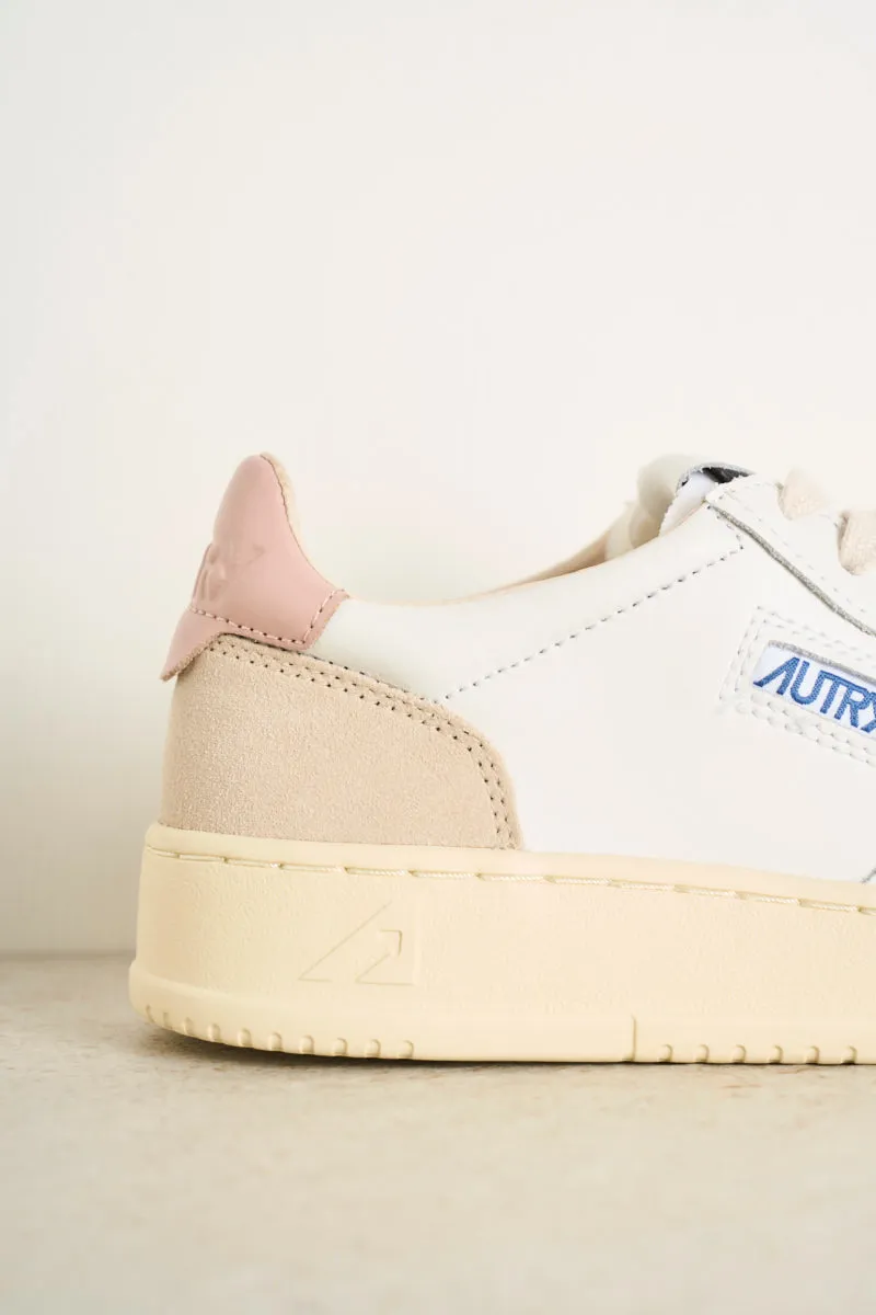 Women's low top leather white and pink sneakers with beige suede.