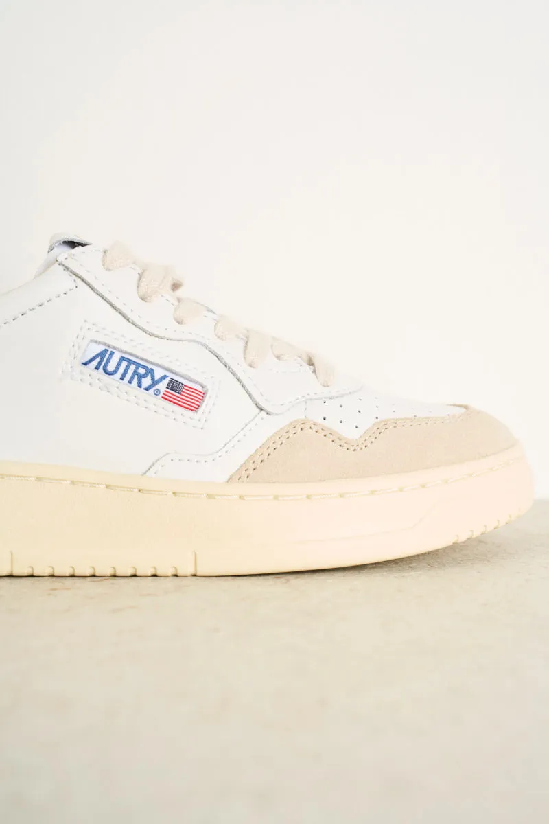 Women's low top leather white and pink sneakers with beige suede.