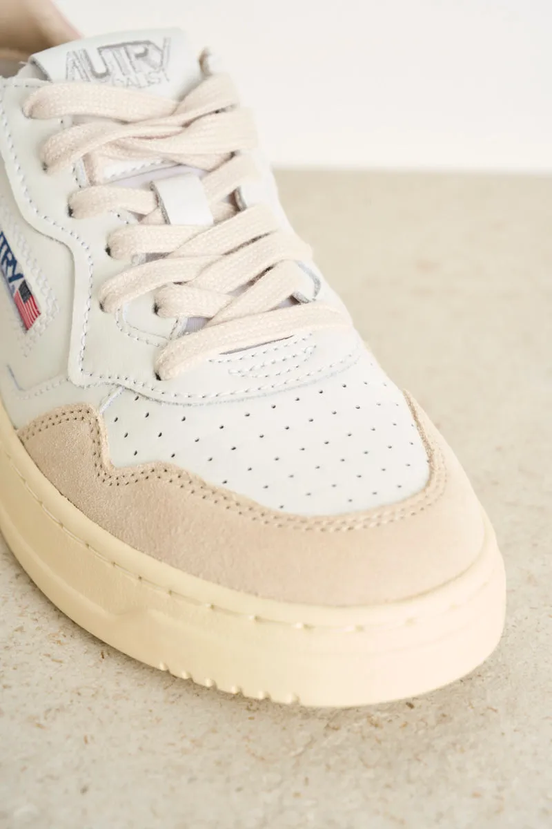 Women's low top leather white and pink sneakers with beige suede.