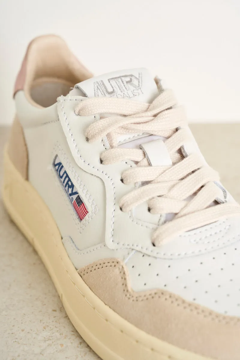 Women's low top leather white and pink sneakers with beige suede.